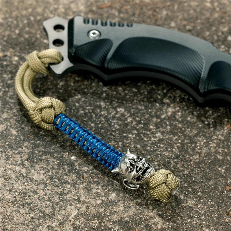 MKENDN New Design Japanese demon Evil mask Men Keychains Backbag Knife Pendant Men Survival Lanyard Rope Handmade Jewelry Gifts