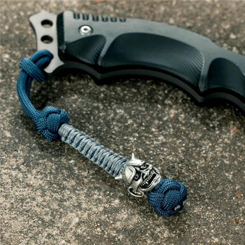 MKENDN New Design Japanese demon Evil mask Men Keychains Backbag Knife Pendant Men Survival Lanyard Rope Handmade Jewelry Gifts