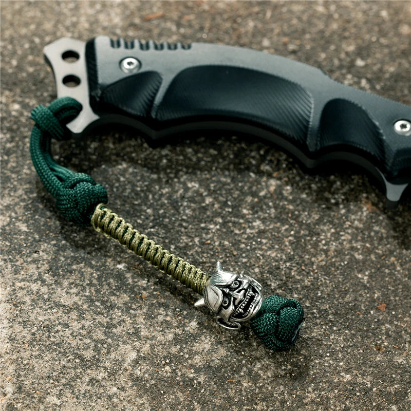 MKENDN New Design Japanese demon Evil mask Men Keychains Backbag Knife Pendant Men Survival Lanyard Rope Handmade Jewelry Gifts