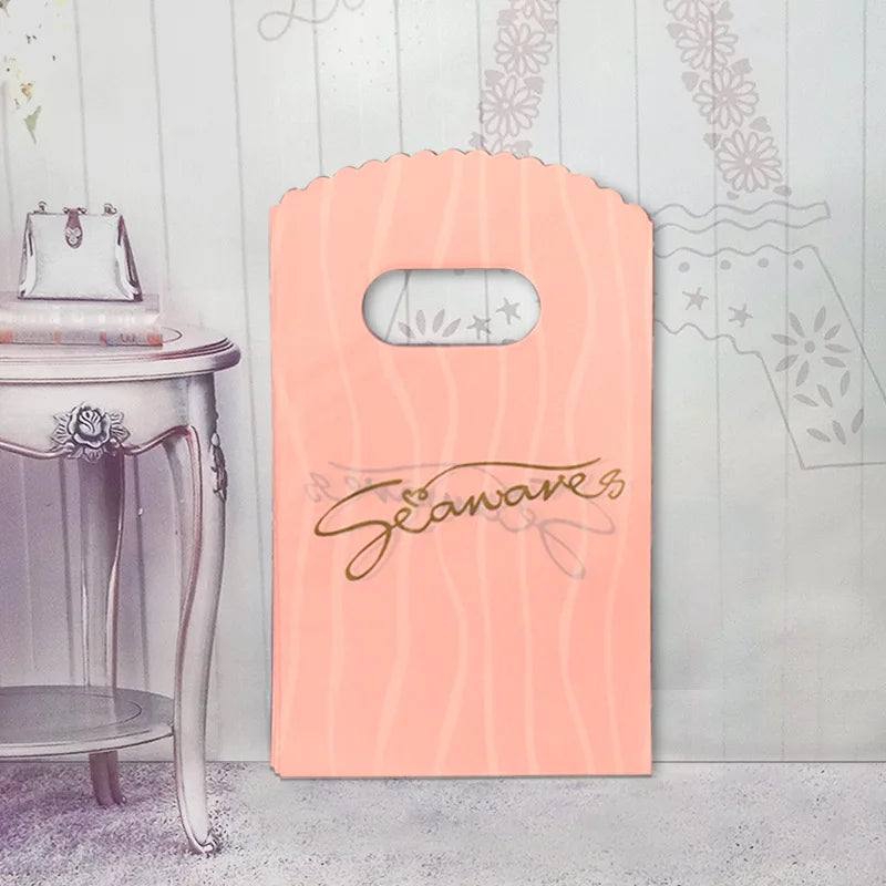 50 teile/los Verschiedene Muster Schmuck Plastiktüte Herzförmigen Ovalen Griffen Mini Geschenkverpackungsbeutel Shop Kleine Einkaufstaschen