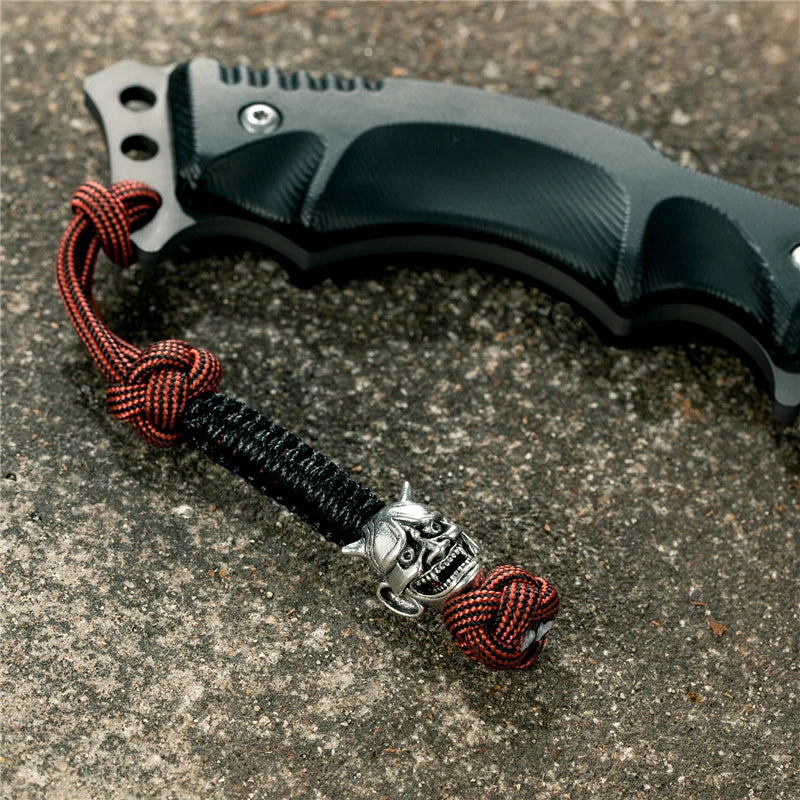 MKENDN New Design Japanese demon Evil mask Men Keychains Backbag Knife Pendant Men Survival Lanyard Rope Handmade Jewelry Gifts