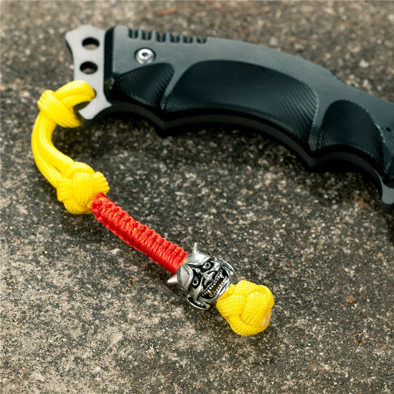 MKENDN New Design Japanese demon Evil mask Men Keychains Backbag Knife Pendant Men Survival Lanyard Rope Handmade Jewelry Gifts