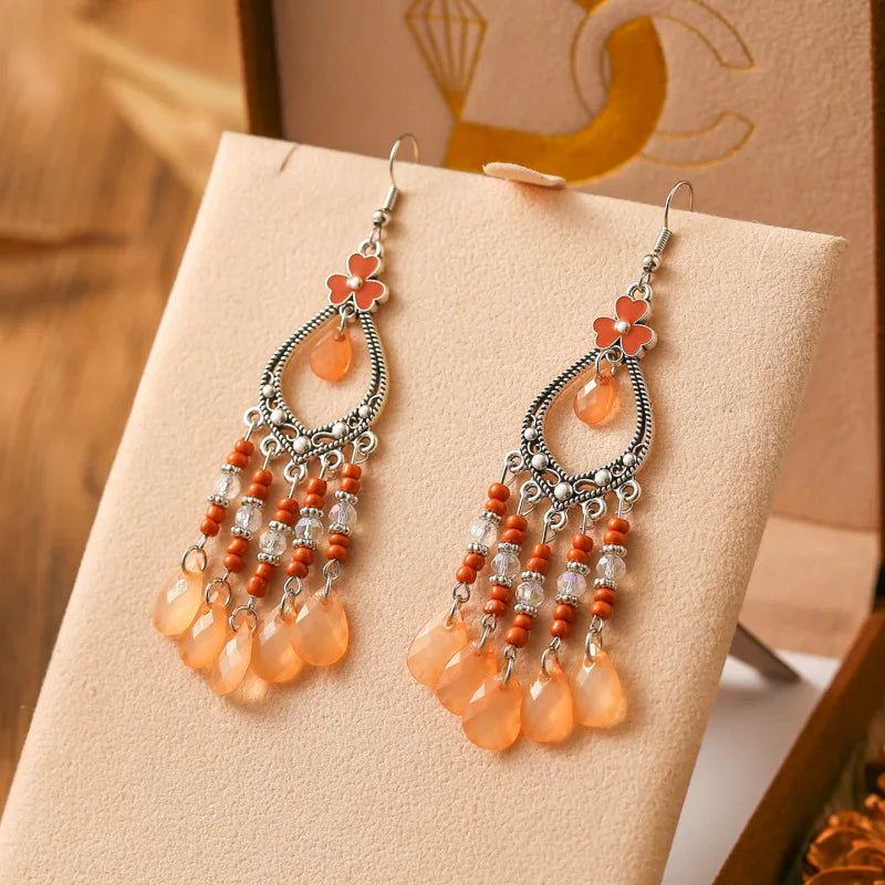 Neue böhmische Ohrringe mit langen Reisperlen in Tropfenform für Damen, ethnisch-retro, tropfenförmig, hohl, baumelnd, Schmuck für Urlaub und Party