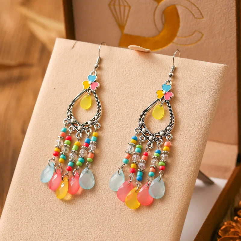 Neue böhmische Ohrringe mit langen Reisperlen in Tropfenform für Damen, ethnisch-retro, tropfenförmig, hohl, baumelnd, Schmuck für Urlaub und Party